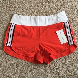 NWT. Athleta orange ascender shorts size 16